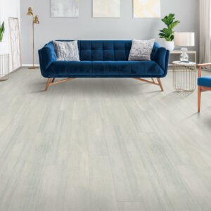 Blue couch on Laminate flooring | All American Remnants & Rolls